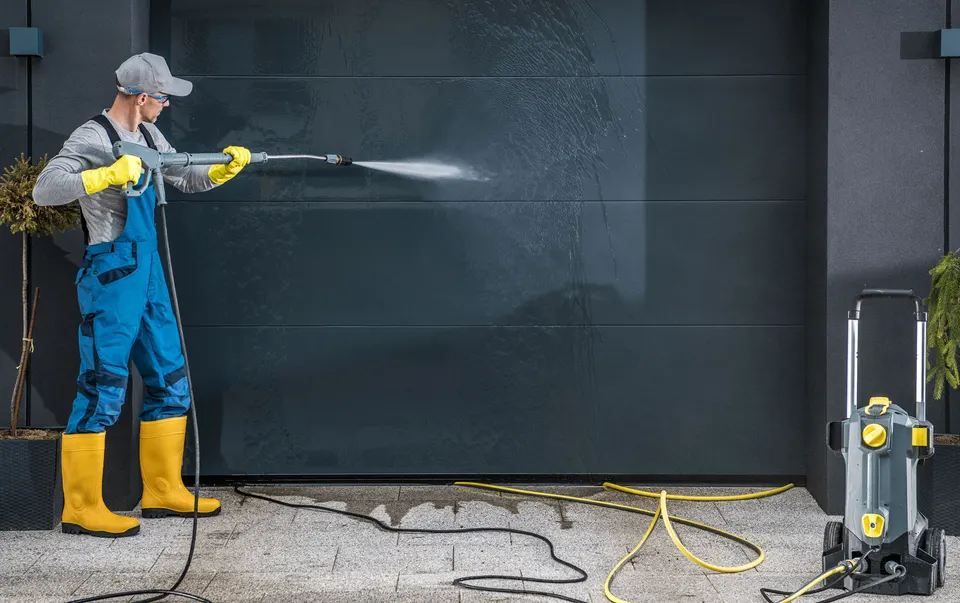 Professional pressure washing equipment laid out ready for a job